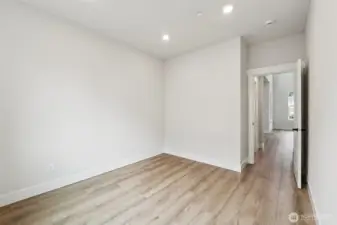 Den on main floor.  Pic of similar home, colors and materials may vary