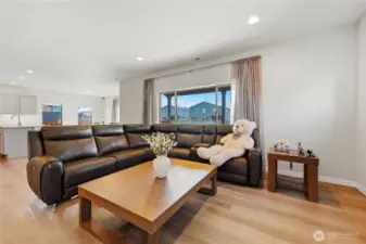 Open layout connecting seamlessly to the kitchen and dining areas.