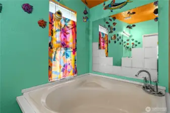 The soaking tub in the primary bathroom, perfect for a relaxing soak.