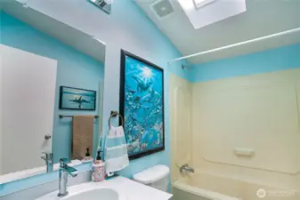 The second full bathroom is accessed from the hallway to the family room and 2nd and 3rd bedrooms.