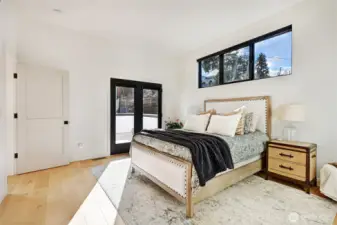 This bedroom is on the upper level and has a door out to the deck.