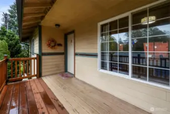 View from top of stairs of deck to front entrance