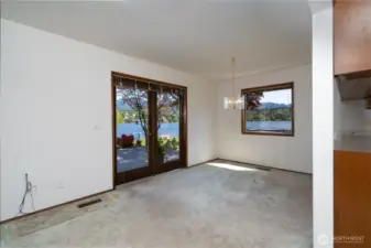 French doors lead to backyard deck made of composite material for low maintenance and easy cleaning.