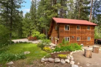 Mazama: Custom 2BD, 1.5BA home in Mazama’s coveted Deer Run community. Built in 1998 with 1,356 SF, featuring an open layout, vaulted wood ceilings, main floor bedroom, full bath, utility room, and spacious back deck. Upstairs offers a primary bedroom, ½ bath, and versatile loft for office or guest space. Covered front porch, landscaped yard, dog kennel, gravel drive, and custom outdoor climbing wall. Enjoy direct access to ski and fat bike trails, plus hiking/biking to the Mazama Store & Pub. Shared Methow Riverfront with sandy beach, mountain views, and peaceful setting.