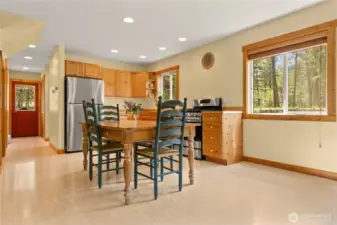 Pen-concept kitchen, dining, and living area