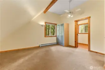 Upstairs primary bedroom with private half bath