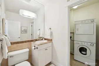 Stylish 1/2 bath on main is adjoined with the in unit laundry room