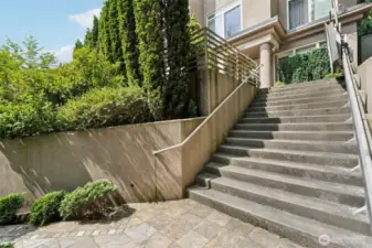 Grand exterior entry stairs leading up to building, from Thorndyke Ave