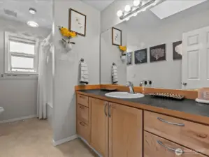 Second full bath upstairs off the 2nd guest room with skylight