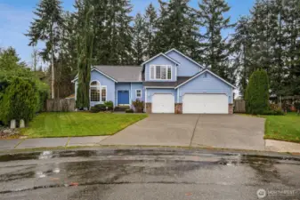 Front of house from cul-de-sac. Long driveway for plenty of off street parking. Sidewalks throughout the neighborhood.