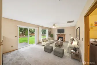 Family room w/slider to backyard. (virtually staged)