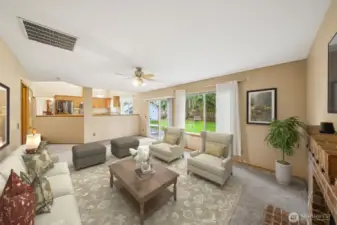 Family room looking back at kitchen. (virtually staged)