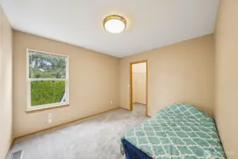 3rd bedroom on upper level with walk - in closet.