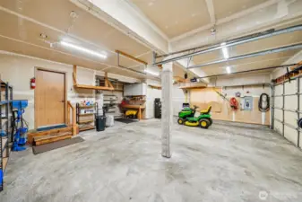 3 car garage with shop area. Riding mower is negotiable.