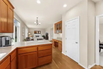 Nice desk area cabinetry and walk-in pantry centrally located between the kitchen & family room.