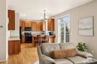 View of the kitchen from the family room with sliding door and transom for good access to the backyard & deck area.