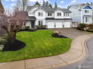 Beautiful lush landscaped lawn.