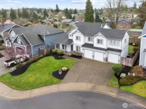 Large driveway plus three car garage offers lots of different options for parking.