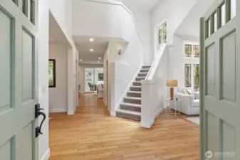 Step into the welcoming foyer with gleaming hardwoods, vaulted ceilings, and fresh interior paint—setting the elevated tone for the entire home.