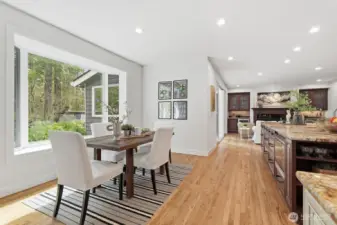 Charming breakfast nook with scenic window seat, framing the expansive, mature beauty of the Pacific Northwest.