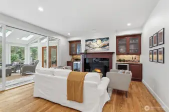 Kitchen opens to the family room, complete with a inviting gas fireplace, creating a warm and welcoming space for family and friends.