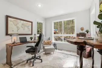 Enjoy a light-filled office with heated decorative tile floors and gorgeous views of the backyard.