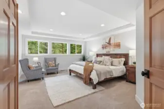 Expansive upper-level primary suite with double-doors and new carpet throughout.