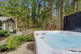 Relax in a new saltwater hot tub while the 8-zone Rain Bird sprinkler system keeps the lush grounds beautifully irrigated.