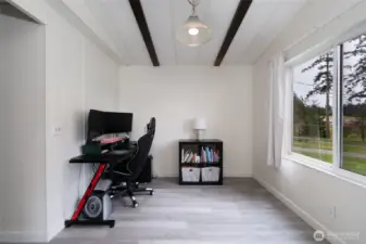 Dedicated home office or flex space with large windows and natural light—perfect for remote work, study, or creative use. Quiet and functional environment.
