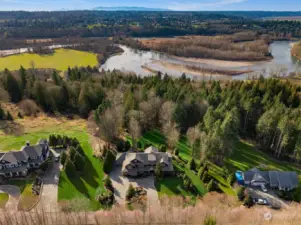 Just up the hill from the Snohomish River, this serene estate is sited on a tree-lined drive culminating in a cul-de-sac. It offers westerly views of its manicured grounds and northerly views of Mt. Baker.