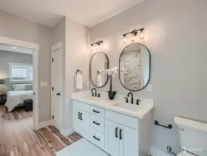 Primary ensuite bathroom with dual sinks