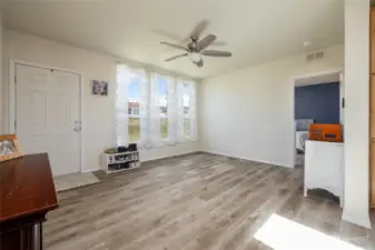 This large room is flex space. It could be 2nd living room, dining room, or kids play area.