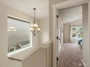 Hallway with vaulted ceilings