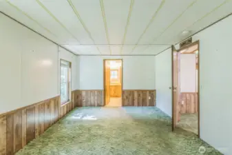 Back to the other end of the home where the oversized primary suite lies looking towards the en-suite bath.