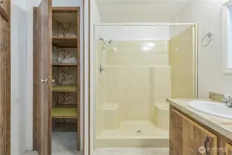 Looking back towards the walk-in shower is more storage likely for linens.