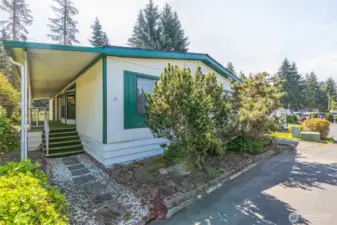 Main entrance highlighting the expansive covered deck.