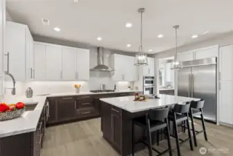 Modern kitchen is equipped with top-of-the-line appliances. For representation purposes only colors may vary.