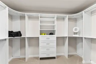 Spacious primary walk-in closet.