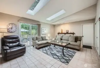 amily room adjacent to Kitchen. Light filled with extra large skylights filled with natural light.