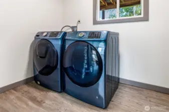 Separate laundry area downstairs