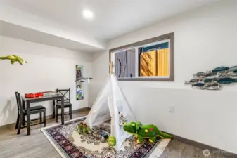 Playroom/office/bedroom has closet and window.
