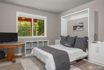 Murphy bed is convenient for a multipurpose room.