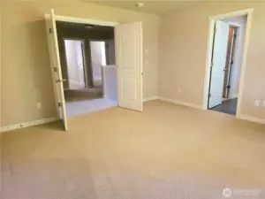 Double doors lead to the master bedroom.