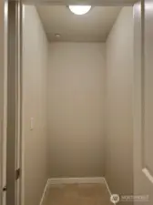 Extra storage area within laundry room.