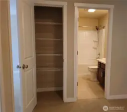 Linen closet off guest bathroom.
