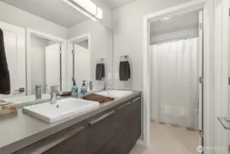 Well appointed hallway bathroom thoughtfully positioned to serve additional guest rooms