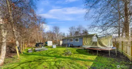 Partially fenced on side and ready when you are to complete!