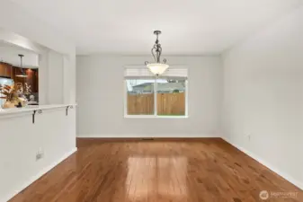 Kitchen + Dining Harmony – Bar area bridges spaces for easy entertaining.