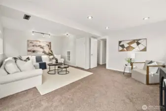 A large, open family room designed for fun, relaxation, and gatherings.