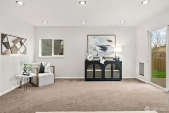 Family room with a glass slider for easy backyard access.